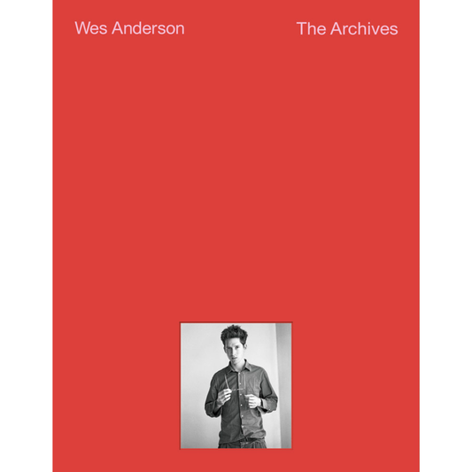 Book cover of 'Wes Anderson The Archives' with a red background and a small black and white photo of a person.